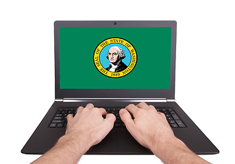 Image showing Hands working on laptop, Washington