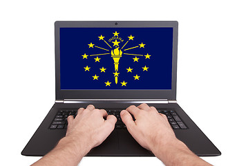 Image showing Hands working on laptop, Indiana