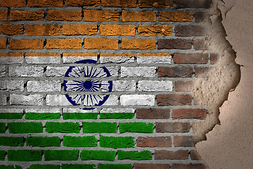 Image showing Dark brick wall with plaster - India