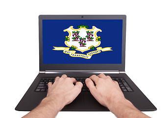 Image showing Hands working on laptop, Connecticut