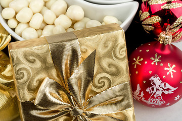 Image showing christmas decoration and golden box with ribbon