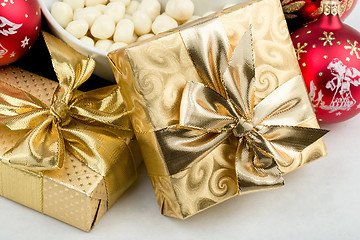 Image showing christmas decoration and golden box with ribbon