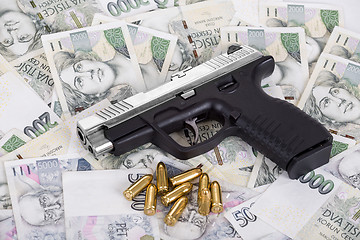 Image showing gun with bullet on czech banknotes