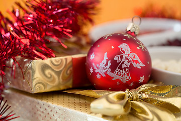 Image showing christmas decoration and golden box with ribbon