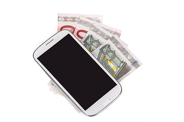 Image showing cellphone and money on white