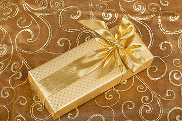 Image showing detail luxury gift with golden ribbon 