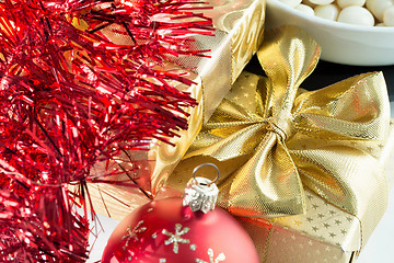 Image showing christmas decoration and golden box with ribbon