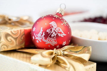 Image showing christmas decoration and golden box with ribbon