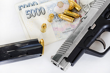 Image showing gun with bullet on czech banknotes