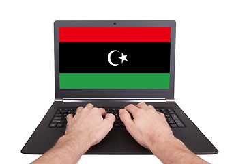 Image showing Hands working on laptop, Libya