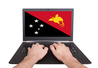 Image showing Hands working on laptop, Papua New Guinea