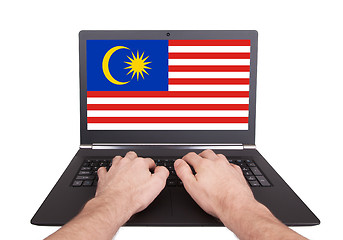 Image showing Hands working on laptop, Malaysia