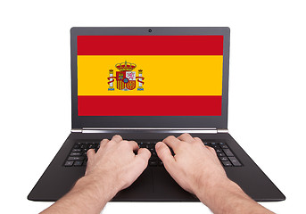 Image showing Hands working on laptop, Spain