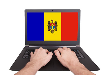 Image showing Hands working on laptop, Moldova