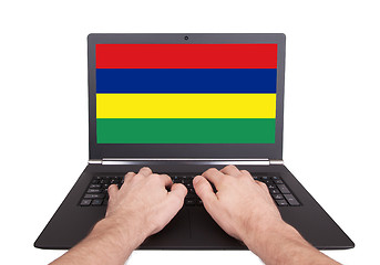 Image showing Hands working on laptop, Mauritius