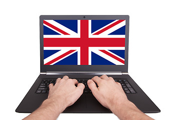 Image showing Hands working on laptop, United Kingdom