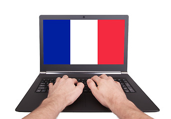 Image showing Hands working on laptop, France