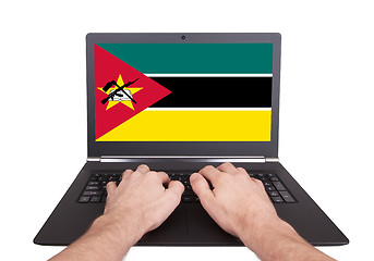 Image showing Hands working on laptop, Mozambique