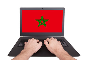 Image showing Hands working on laptop, Morocco