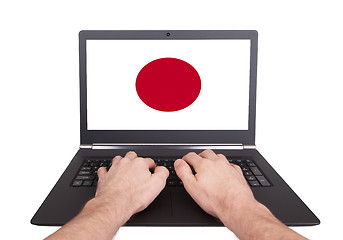 Image showing Hands working on laptop, Japan