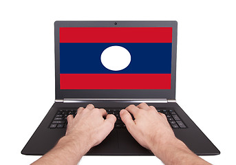 Image showing Hands working on laptop, Laos