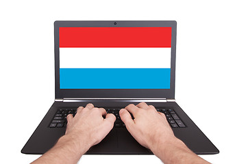 Image showing Hands working on laptop, Luxembourg