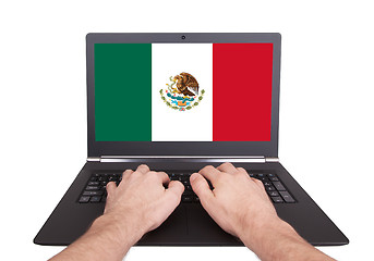 Image showing Hands working on laptop, Mexico