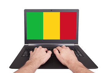 Image showing Hands working on laptop, Mali