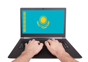 Image showing Hands working on laptop, Kazakhstan