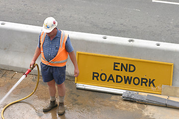 Image showing Workman hosing
