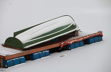 Image showing Winter covered with snow rowing boat