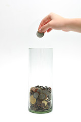 Image showing dropping coin into glass jar