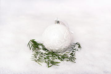 Image showing Christmas ball and fir branch with snow
