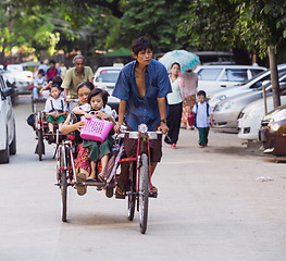 Image showing Schoolchildren on cyclos in Yangon