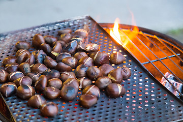 Image showing Grilling chestnuts.