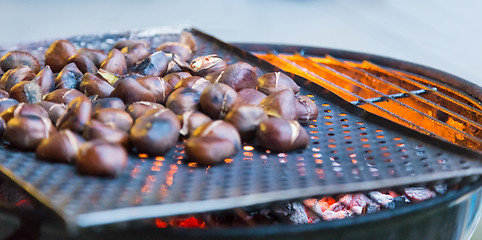 Image showing Grilling chestnuts.