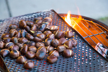 Image showing Grilling chestnuts.