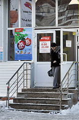 Image showing The woman leaves a drugstore 