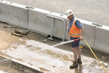 Image showing Workman hosing, no sign