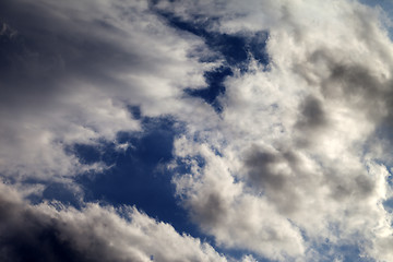 Image showing Sky with sunlight and dark clouds before storm