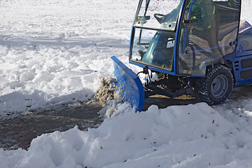 Image showing Blue snowplow removing snow