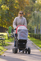 Image showing Mother with pram