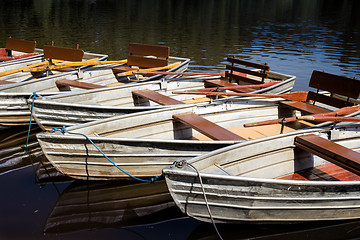 Image showing Empty rowboats at a lake in a row