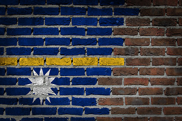 Image showing Brick wall texture with flag