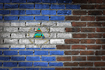 Image showing Brick wall texture with flag