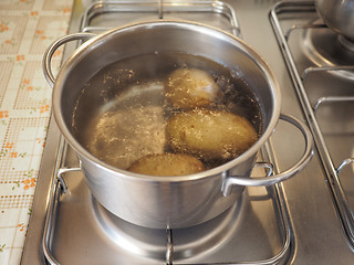 Image showing Saucepot with potatoes on cooker