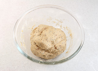 Image showing Freshly kneaded bread dough in a glass bowl