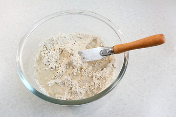 Image showing Mixing water and bread flour mix