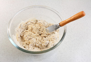 Image showing Mixing malted bread mix with a palette knife 