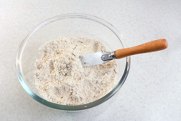 Image showing Mixing bread flour mix and butter with a knife